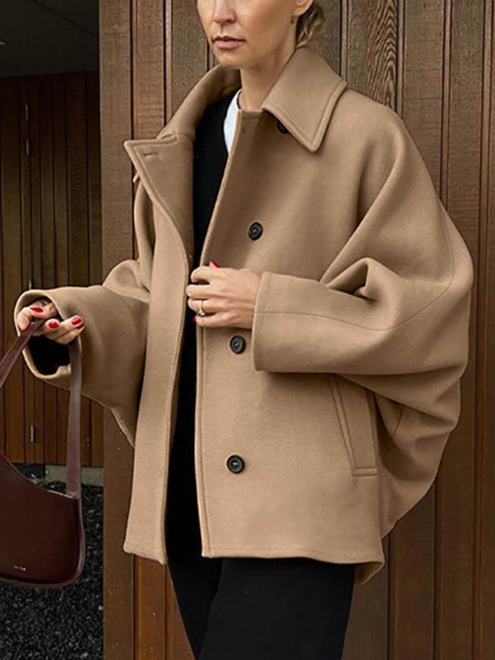 Cappotto cardigan con maniche a pipistrello con risvolto in lana alla moda e di fascia alta